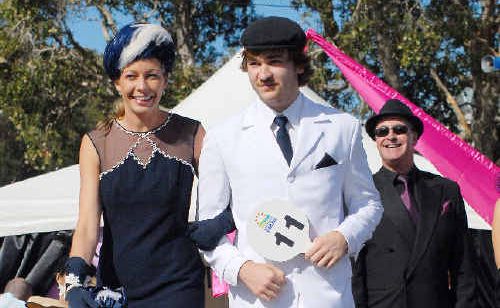 Laura Little and Matt Boyce parade for the judges during Fashions on the Field’s best dressed couple competition. Laura Little and Matt Boyce parade for the judges during Fashions on the Field’s best dressed couple competition.